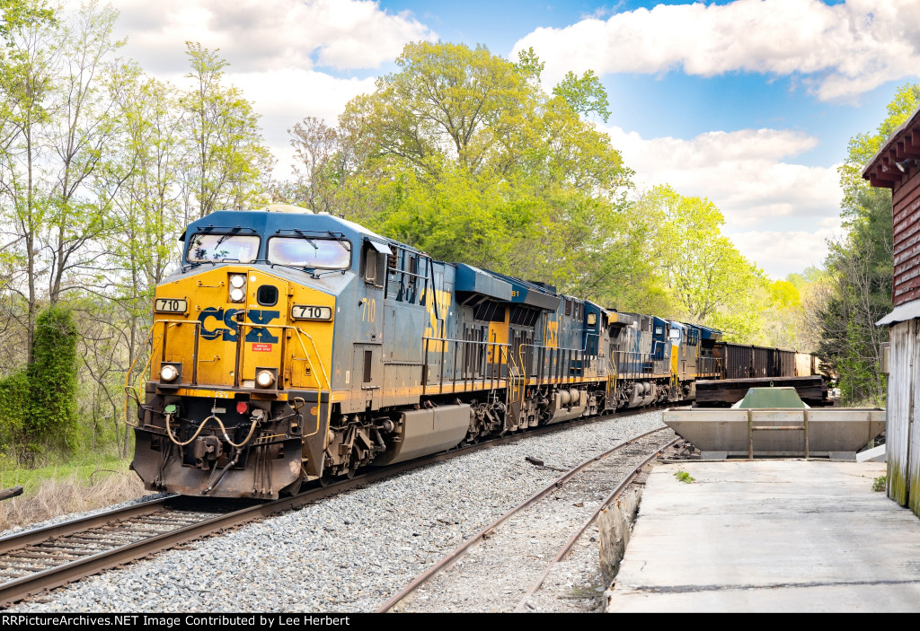 CSX 710 on the lead of an empty coal train